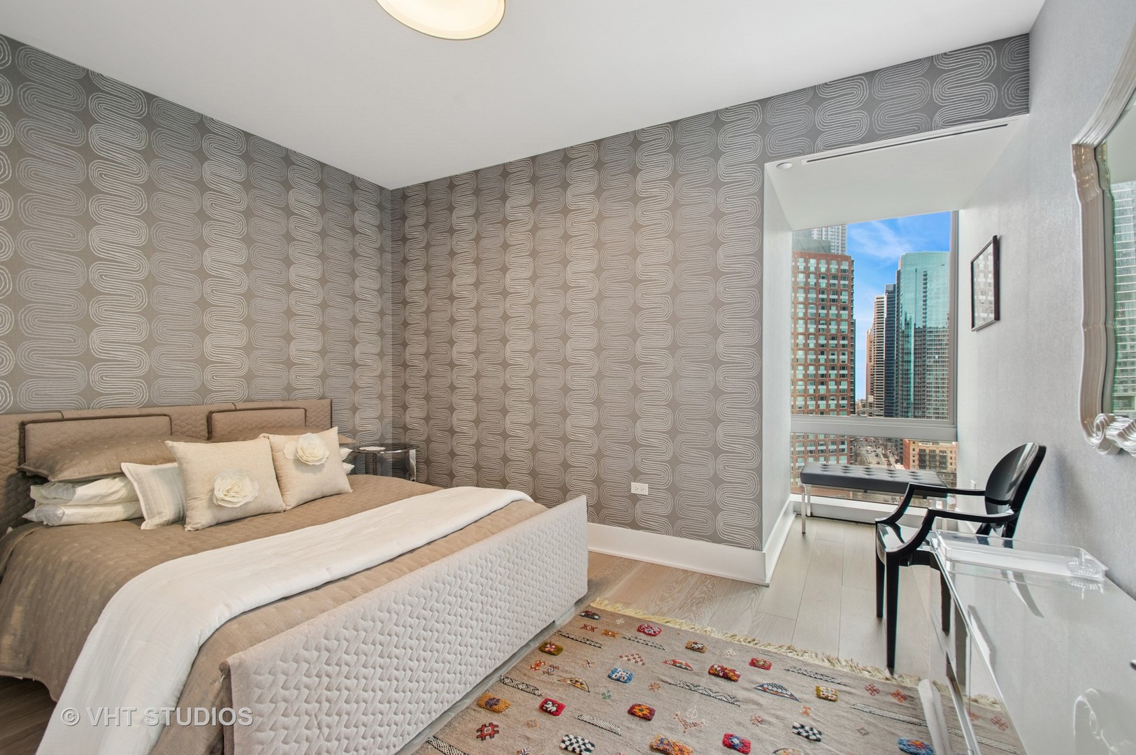 363 East Wacker Drive, Unit 1302 Chicago, IL 60601 - Photo 11 of 31 a bedroom with a bed and a chair