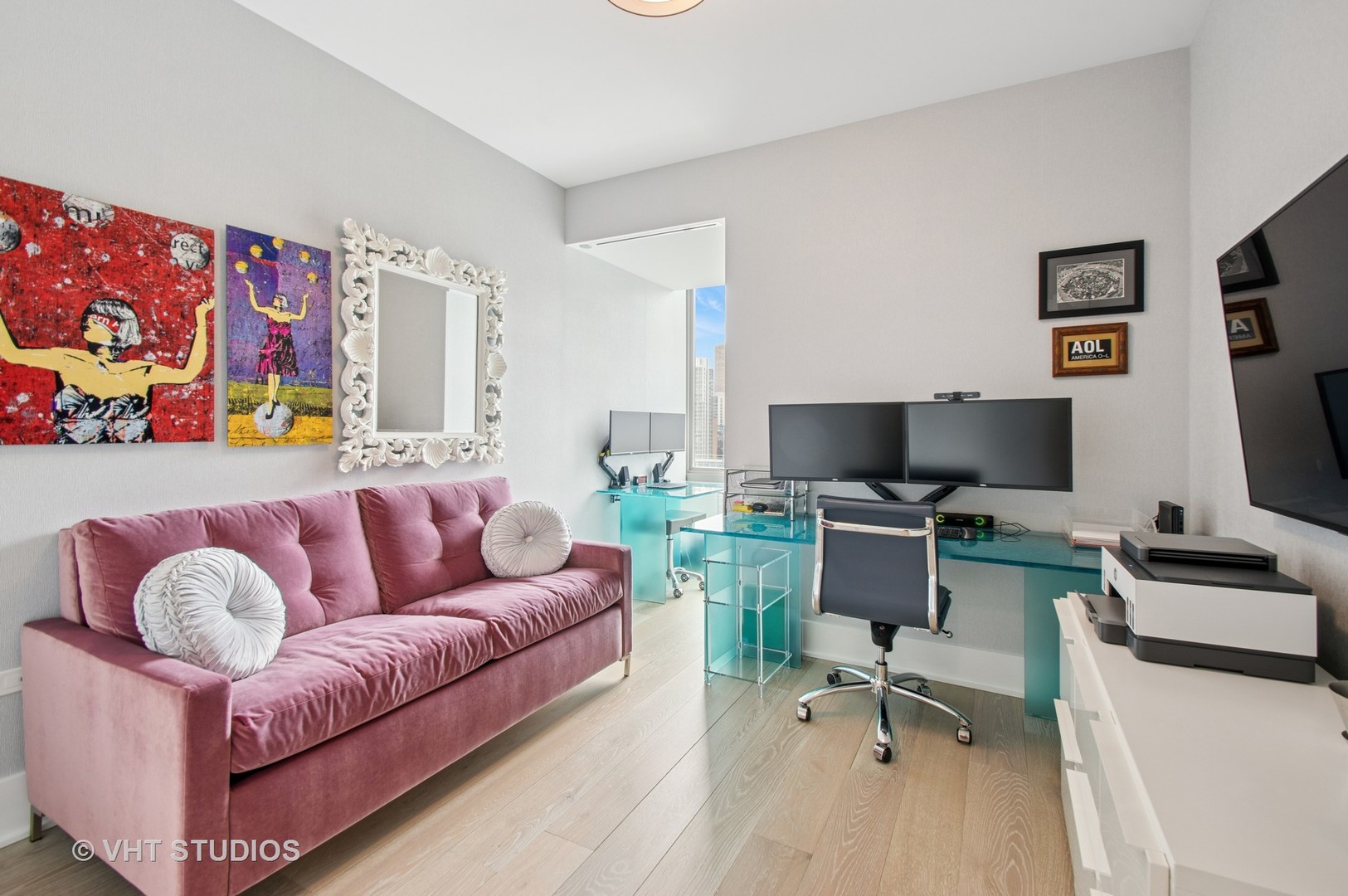 363 East Wacker Drive, Unit 1302 Chicago, IL 60601 - Photo 12 of 31 a work room with furniture and a flat screen tv