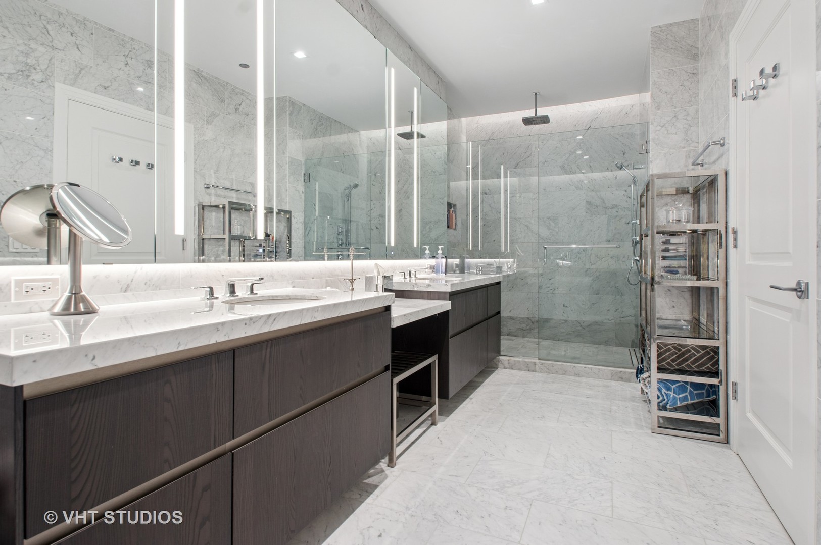 363 East Wacker Drive, Unit 1302 Chicago, IL 60601 - Photo 14 of 31 a bathroom with a double vanity sink mirror and shower
