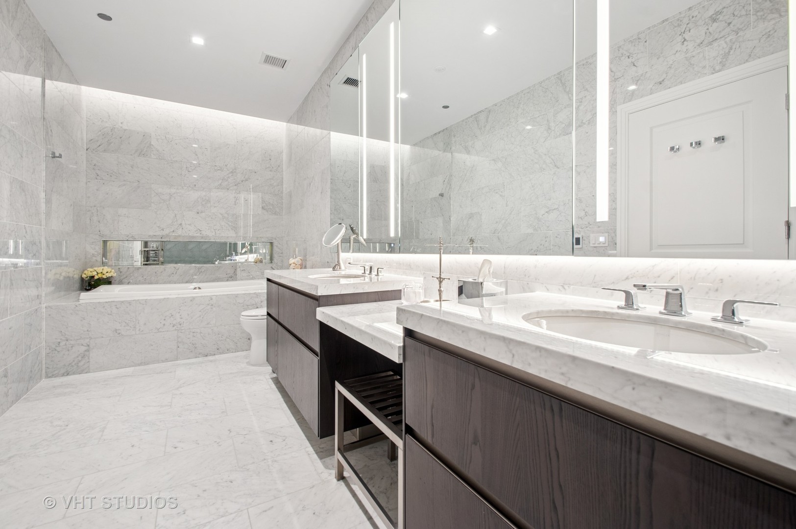 363 East Wacker Drive, Unit 1302 Chicago, IL 60601 - Photo 15 of 31 a bathroom with a sink double vanity and a bathtub