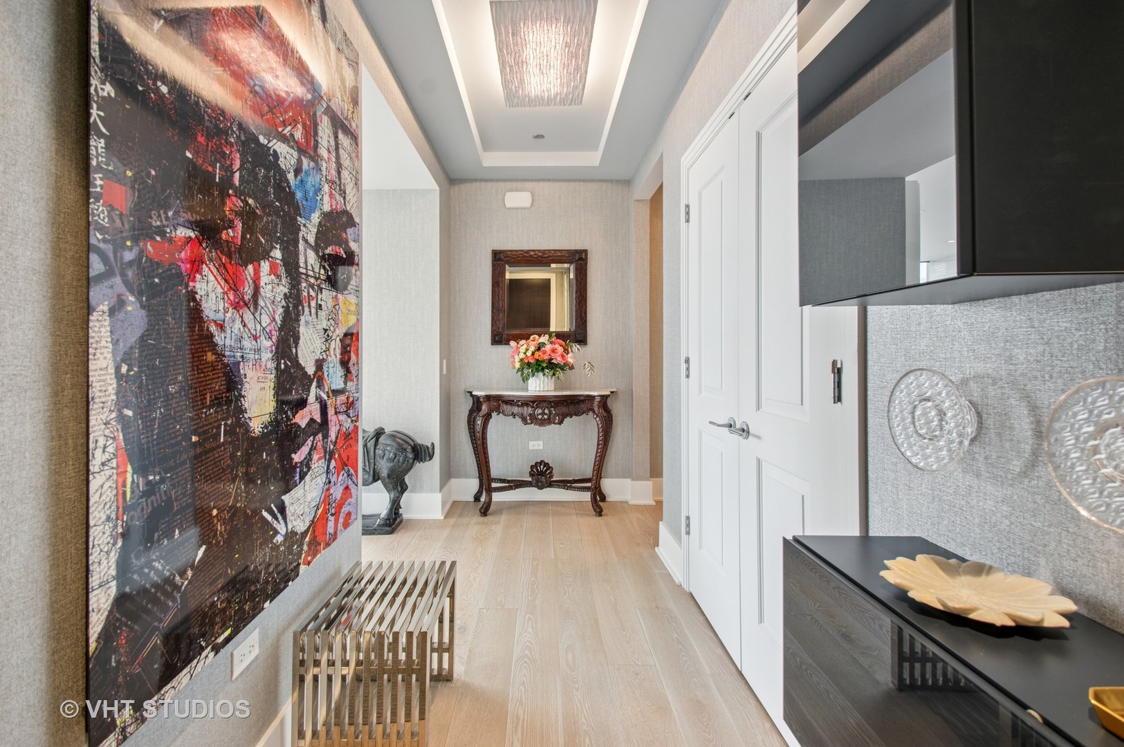363 East Wacker Drive, Unit 1302 Chicago, IL 60601 - Photo 2 of 31 a view of a hallway with workspace and living room