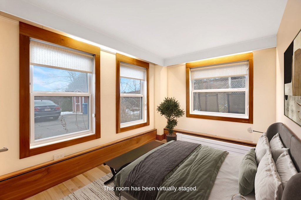 61 Crescent Street, Unit 8 Northampton, MA 01060 - Photo 12 of 30 a bedroom with a bed and glass window