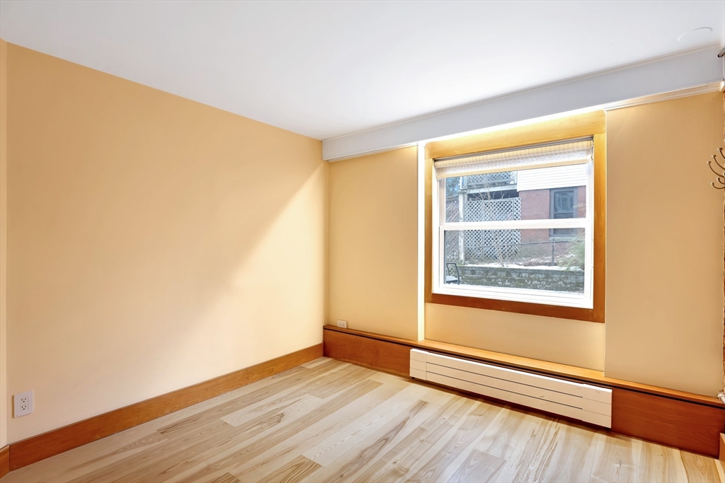 61 Crescent Street, Unit 8 Northampton, MA 01060 - Photo 26 of 30 a view of an empty room and wooden floor and a window