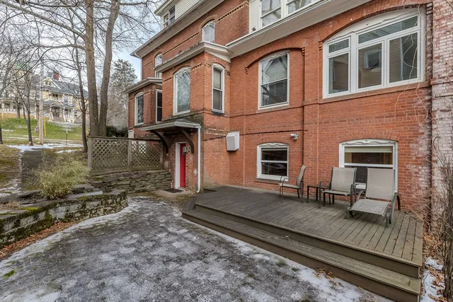 a front view of a house with many windows