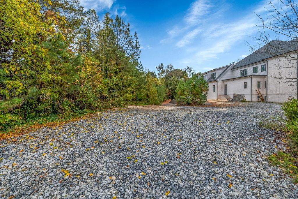 5150 Timber Ridge Road Marietta, GA 30068 - Photo 18 of 24 a view of a backyard with large trees