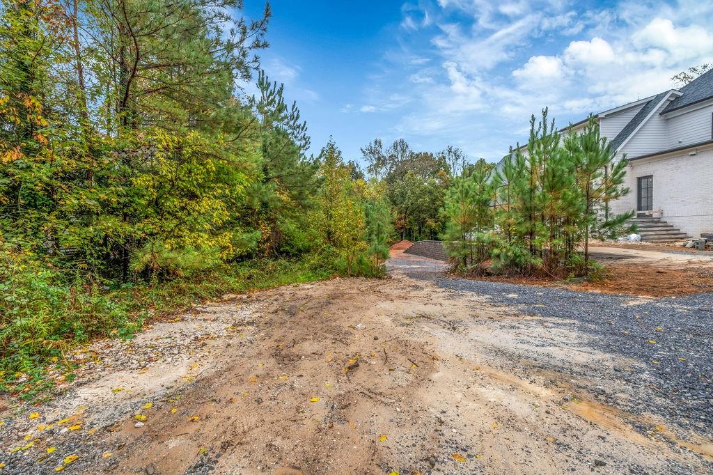 5150 Timber Ridge Road Marietta, GA 30068 - Photo 19 of 24 a backyard of a house with lots of green space