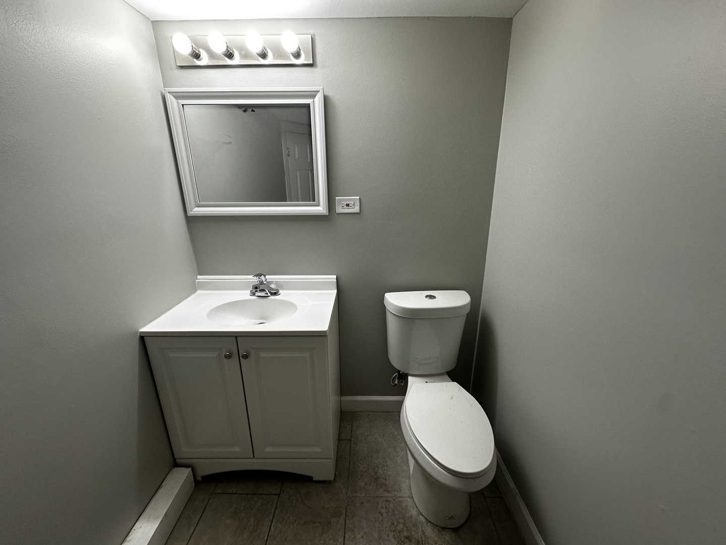 6549 South Keeler Avenue Chicago, IL 60629 - Photo 15 of 16 a bathroom with a toilet sink and mirror