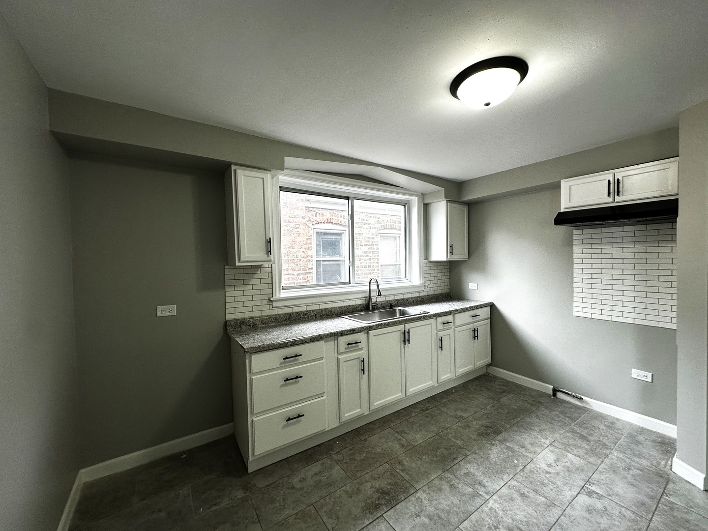 6549 South Keeler Avenue Chicago, IL 60629 - Photo 8 of 16 a large bathroom with a sink and a window