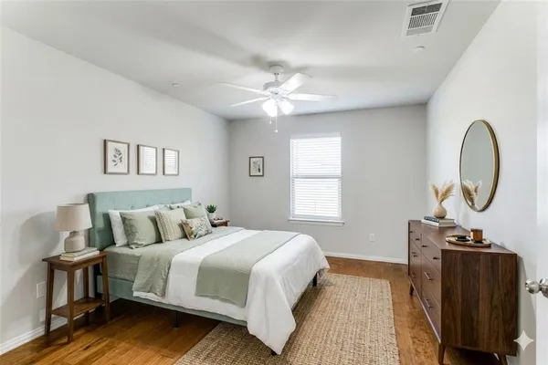 a bedroom with bed and a window