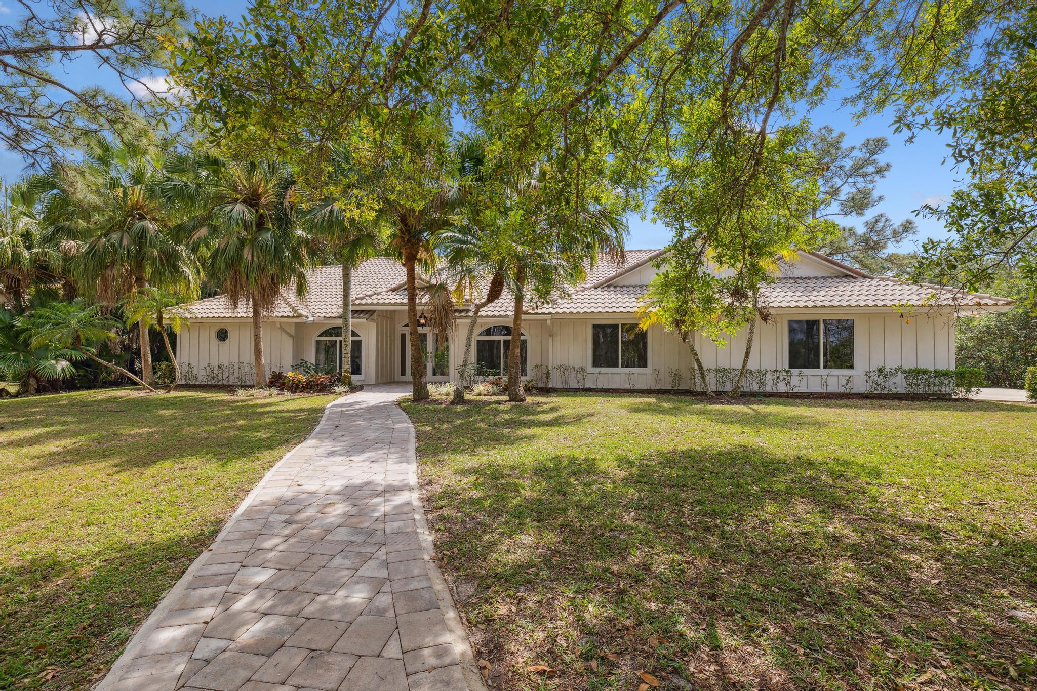 1760 Southeast Colony Way Jupiter, FL 33478 - Photo 1 of 57 Front entrance