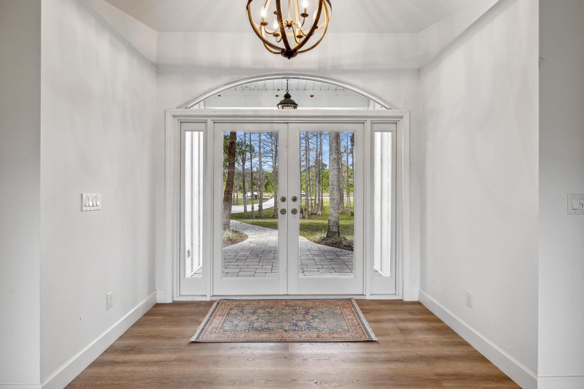 1760 Southeast Colony Way Jupiter, FL 33478 - Photo 6 of 57 Views thru front door