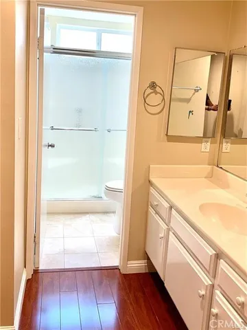 a view of bathroom with a tub and mirror