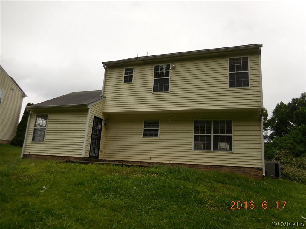 3829 Goodell Road Richmond, VA 23223 - Photo 2 of 11 a front view of a house with a garden