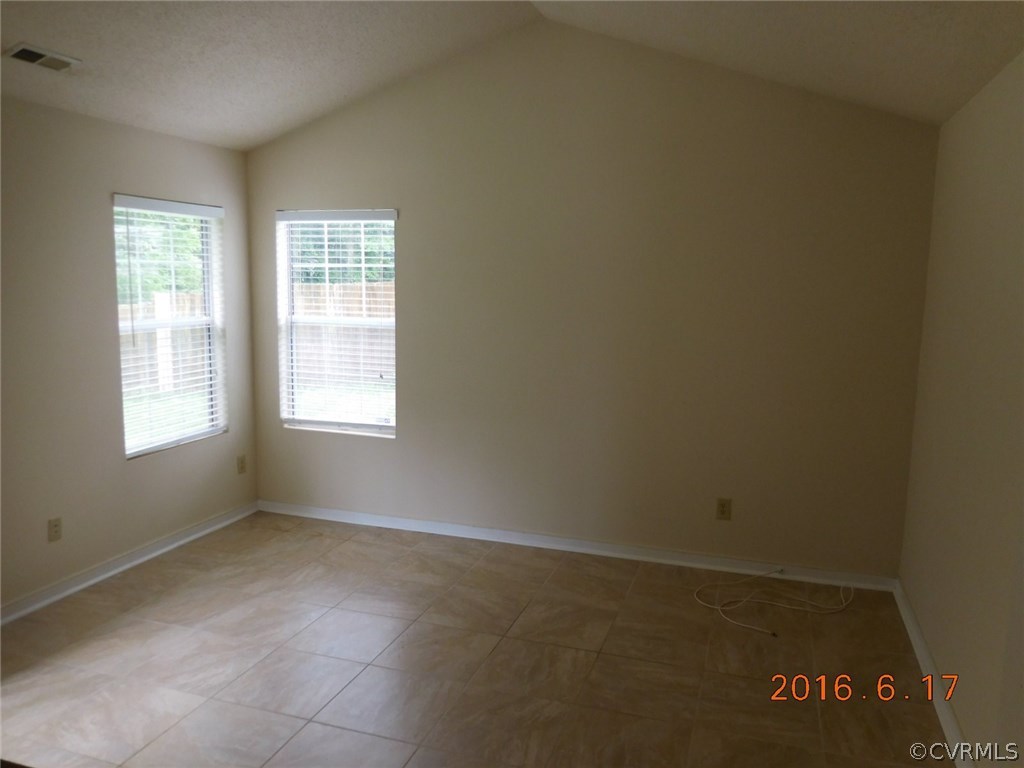 3829 Goodell Road Richmond, VA 23223 - Photo 5 of 11 an empty room with windows