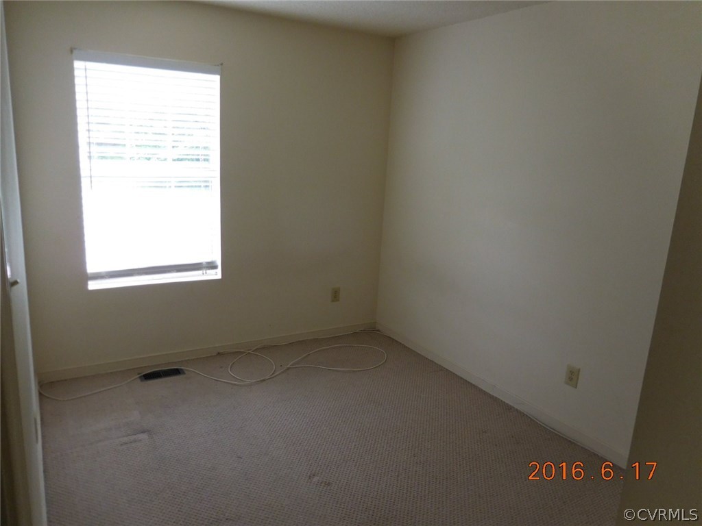 3829 Goodell Road Richmond, VA 23223 - Photo 6 of 11 an empty room with a window