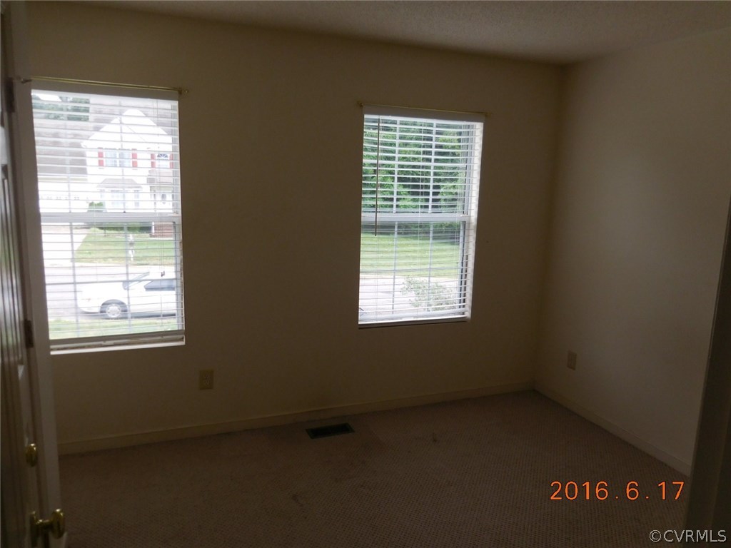 3829 Goodell Road Richmond, VA 23223 - Photo 7 of 11 an empty room with a window