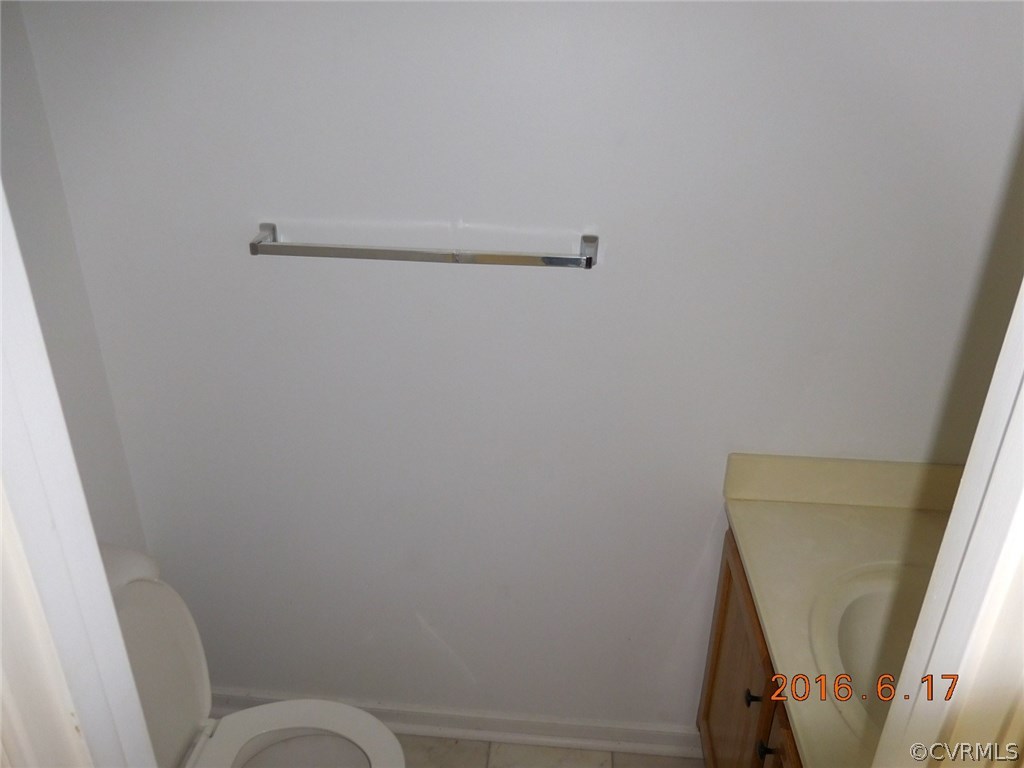 3829 Goodell Road Richmond, VA 23223 - Photo 9 of 11 a bathroom with a sink and toilet