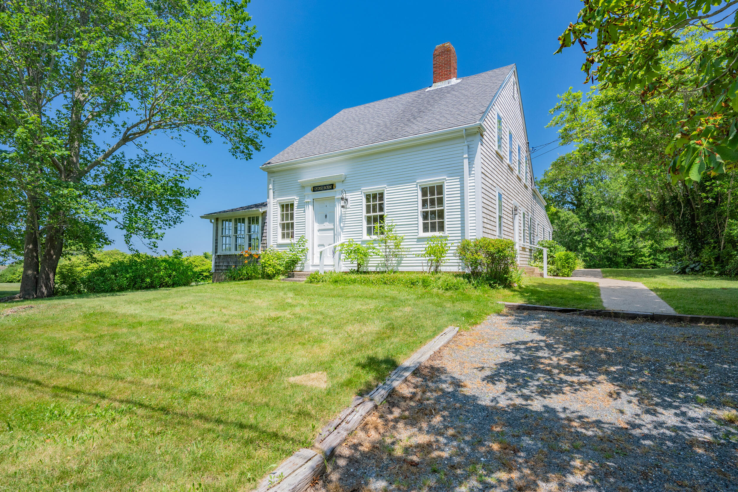 56 Wharf Lane Yarmouth Port, MA 02675 - Photo 1 of 71 a front view of a house with garden