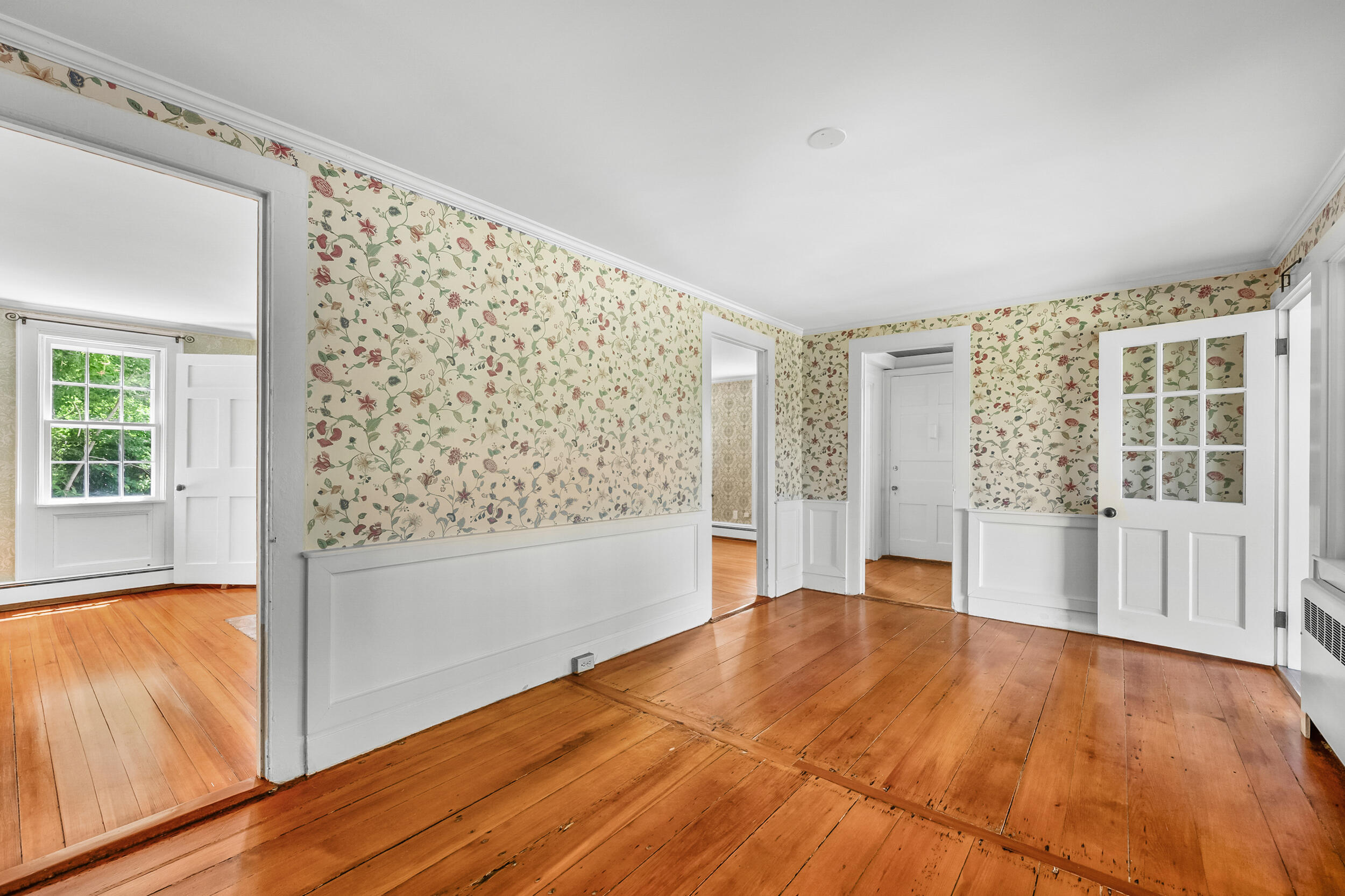 56 Wharf Lane Yarmouth Port, MA 02675 - Photo 14 of 71 a view of empty room with wooden floor and fan
