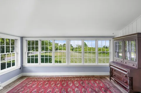 a kitchen with cabinets appliances and a window