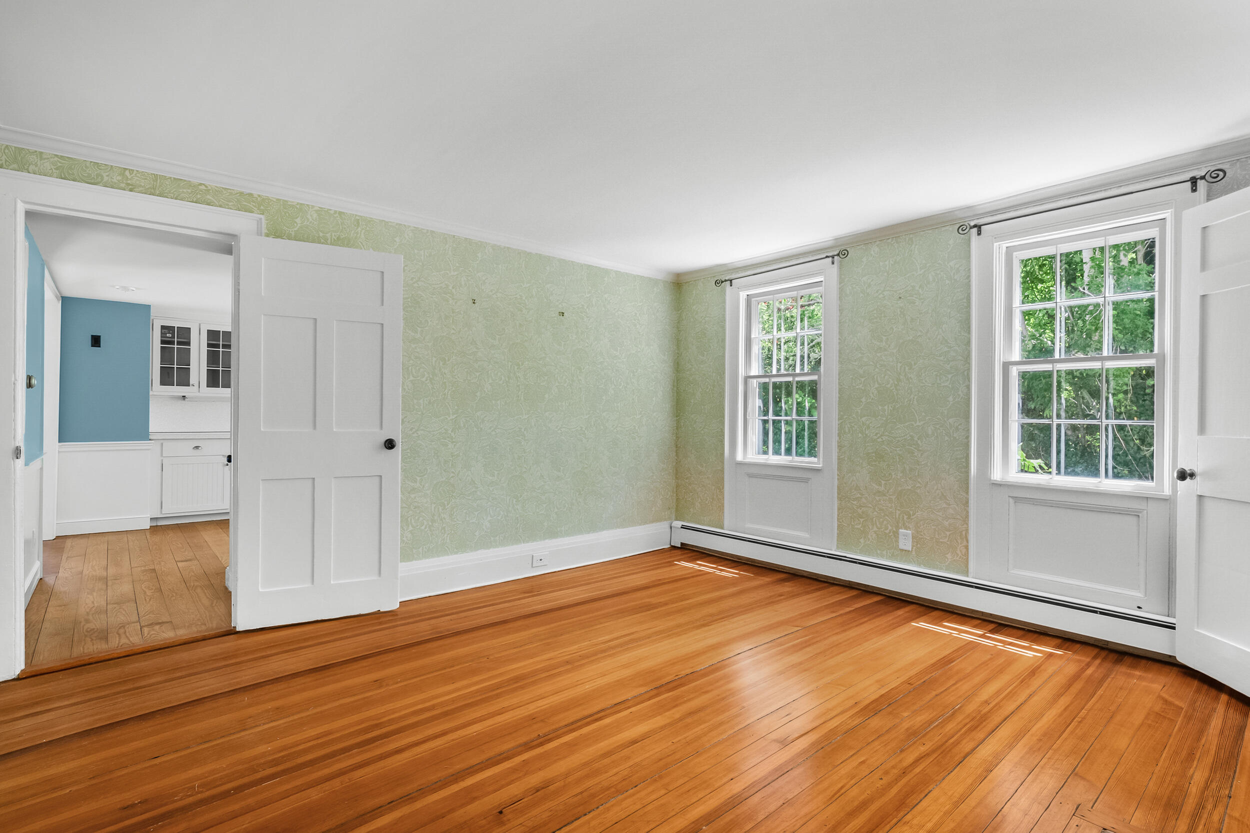 56 Wharf Lane Yarmouth Port, MA 02675 - Photo 19 of 71 a view of an empty room with wooden floor and a window
