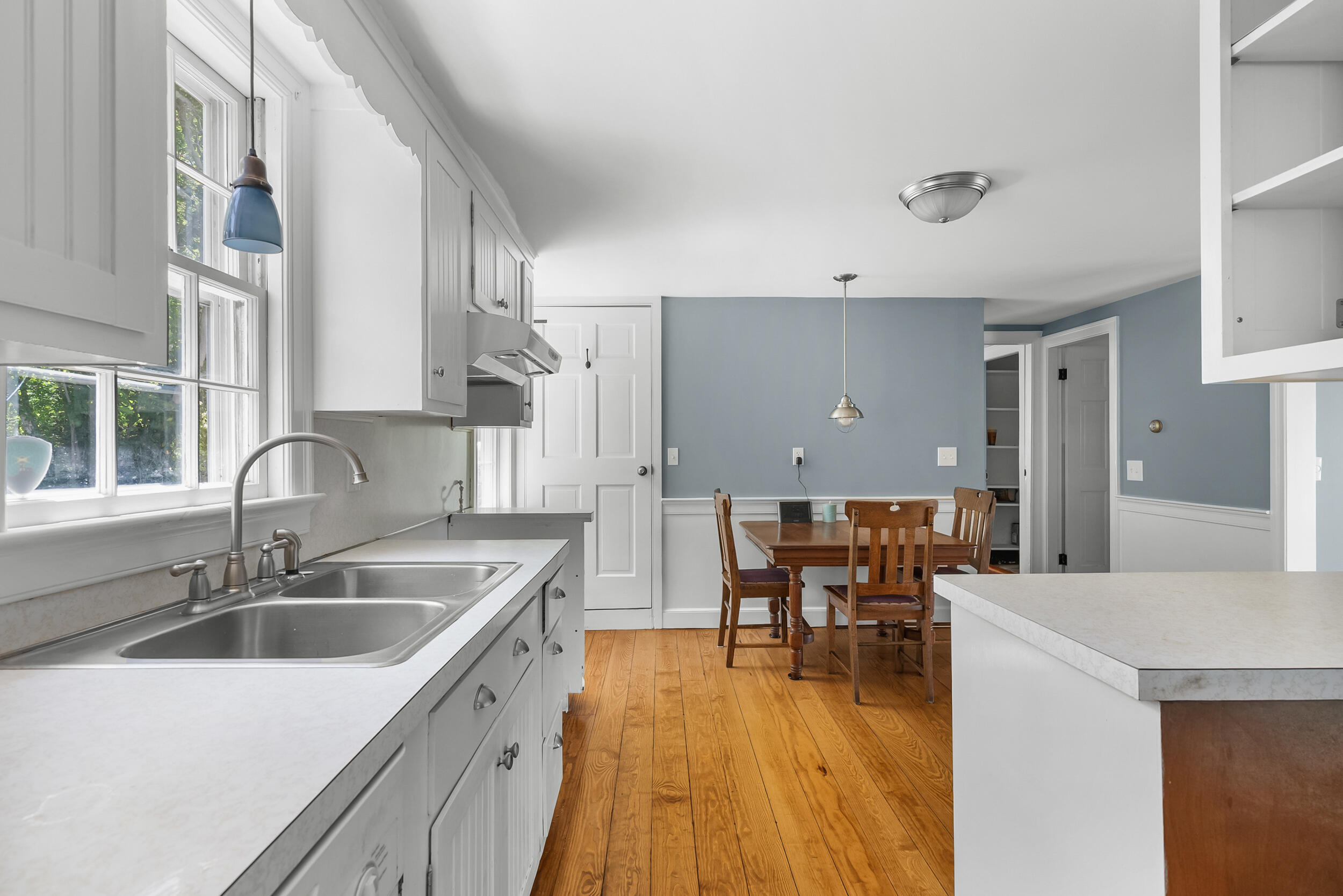 56 Wharf Lane Yarmouth Port, MA 02675 - Photo 24 of 71 a kitchen with stainless steel appliances granite countertop a sink a stove and a wooden floors