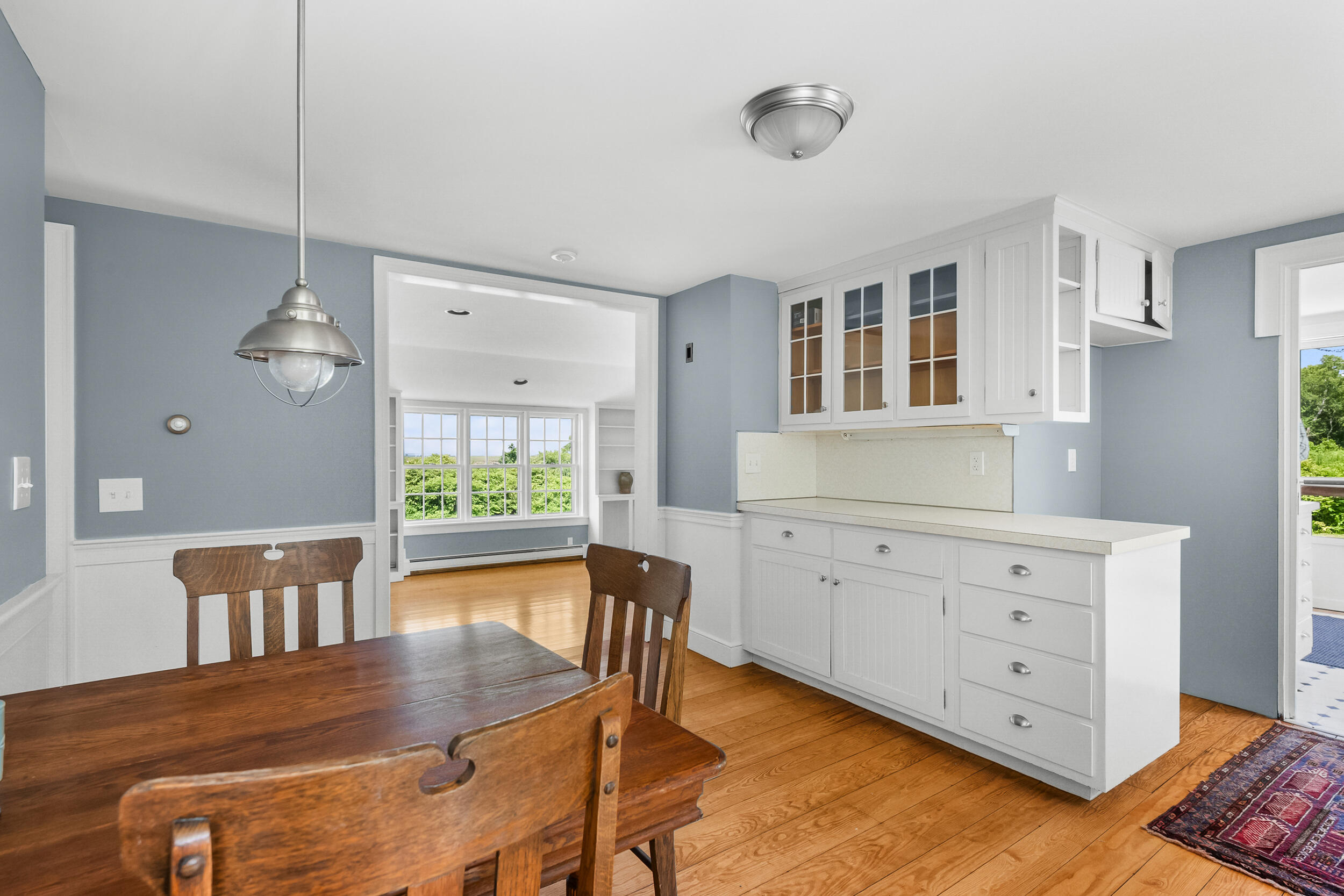 56 Wharf Lane Yarmouth Port, MA 02675 - Photo 25 of 71 a view of a dining room with furniture window and wooden floor