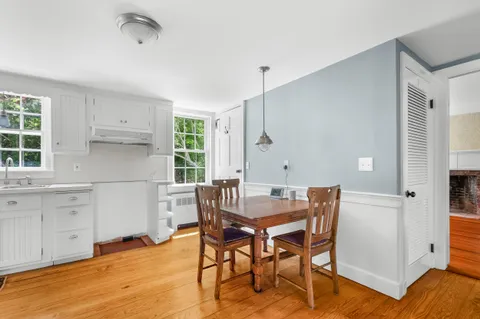 a view of a room with rack on the wall and a window