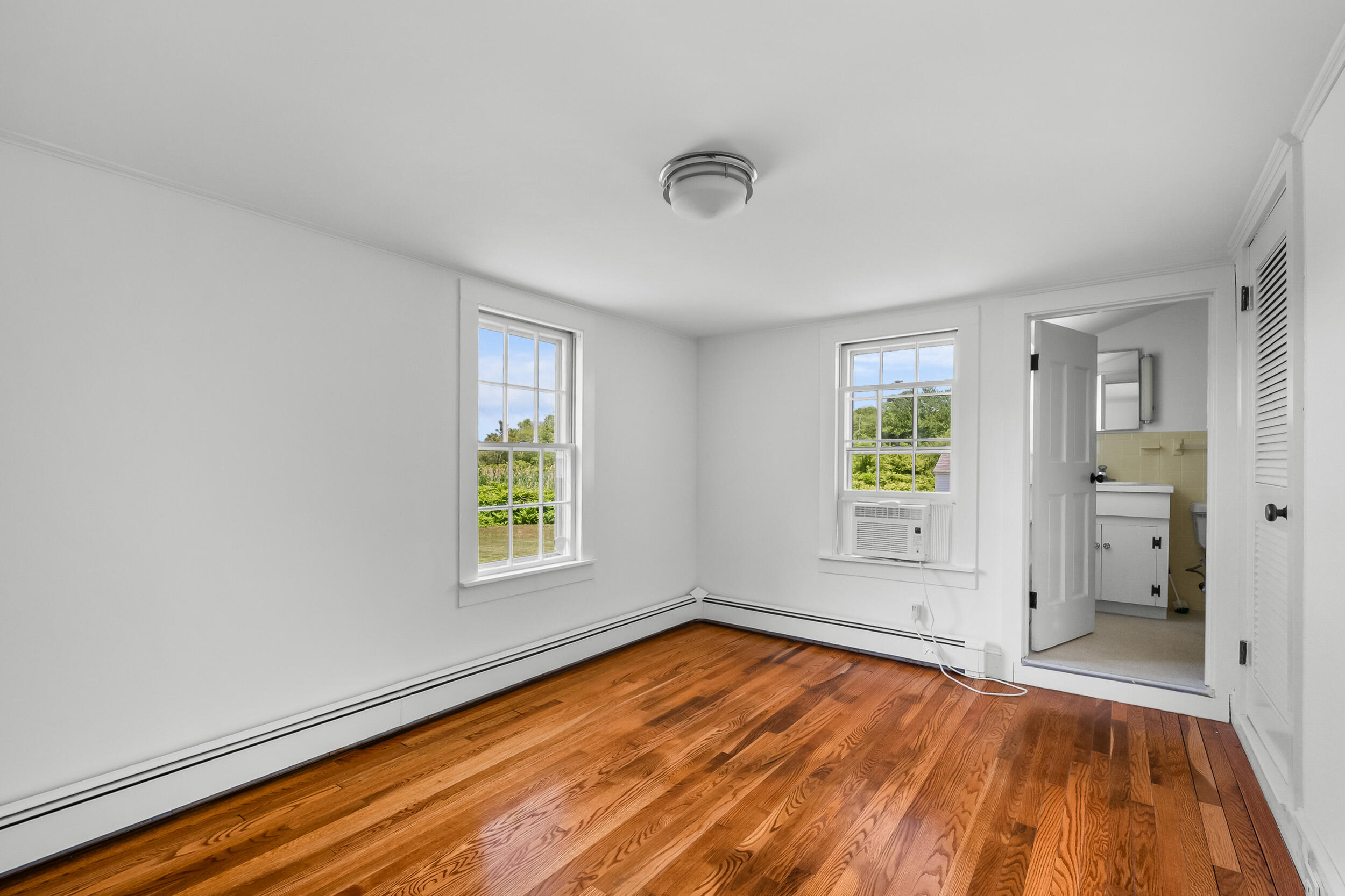 56 Wharf Lane Yarmouth Port, MA 02675 - Photo 34 of 71 wooden floor in an empty room with a window