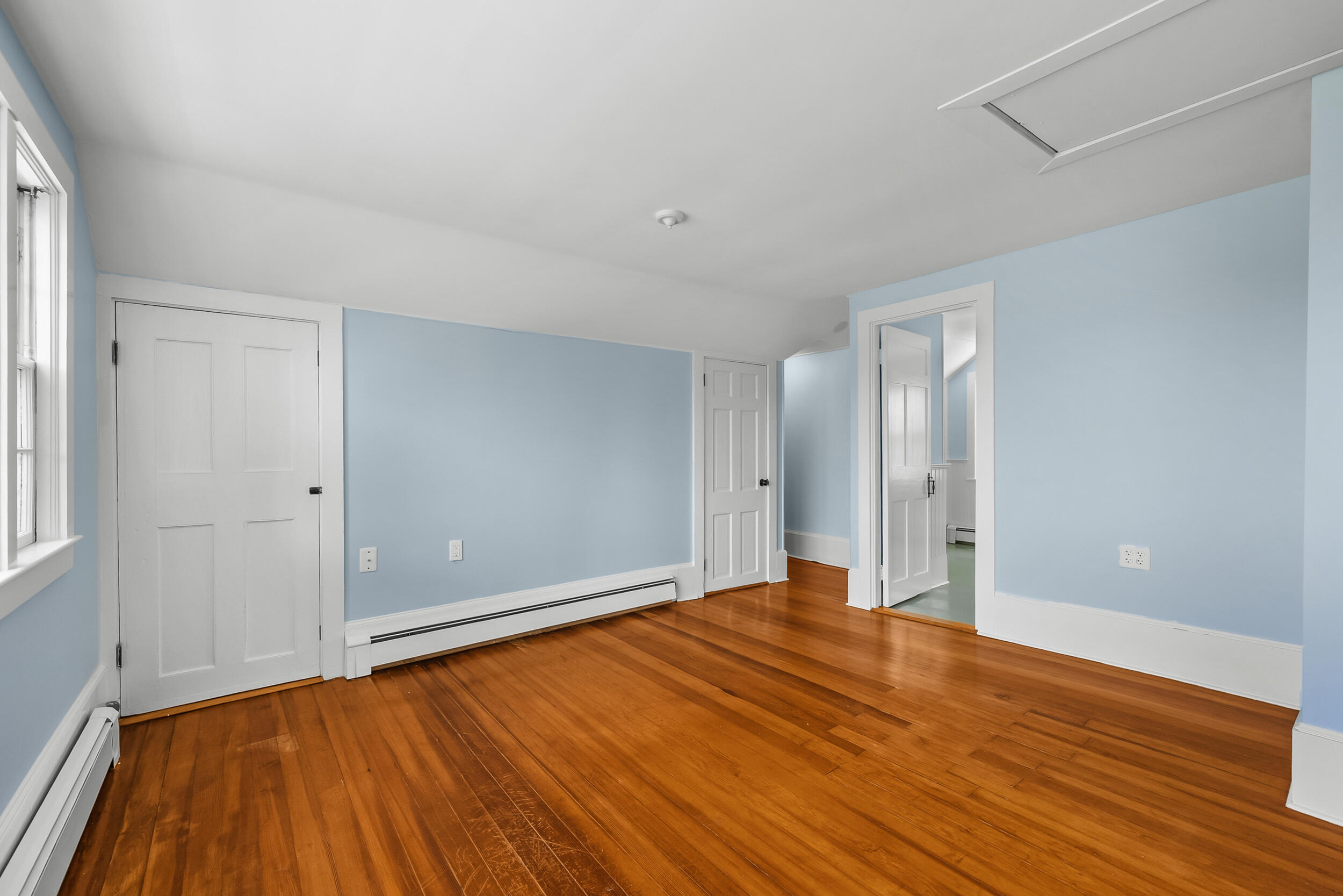 56 Wharf Lane Yarmouth Port, MA 02675 - Photo 39 of 71 a view of an empty room with wooden floor