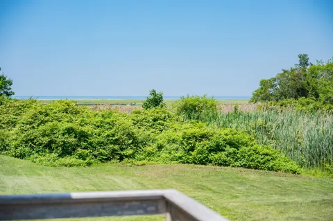 a view of an ocean and a mountain