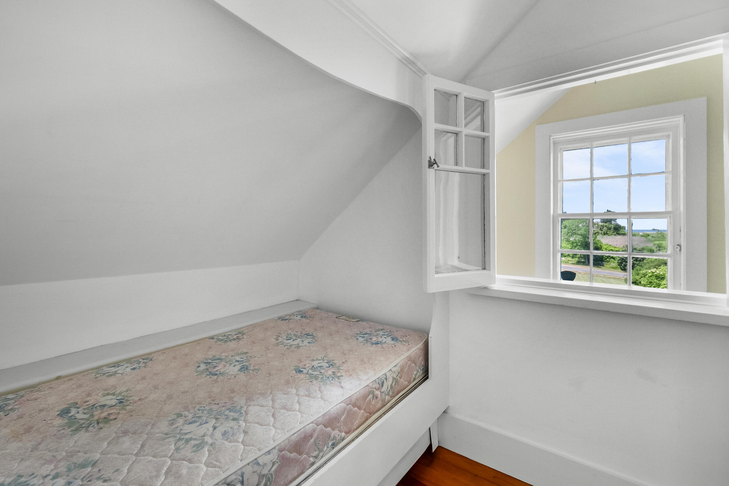 56 Wharf Lane Yarmouth Port, MA 02675 - Photo 45 of 71 a view of a room with rack on the wall and a window
