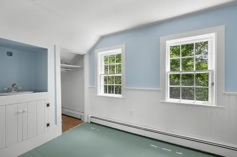 a front view of a house with a big yard