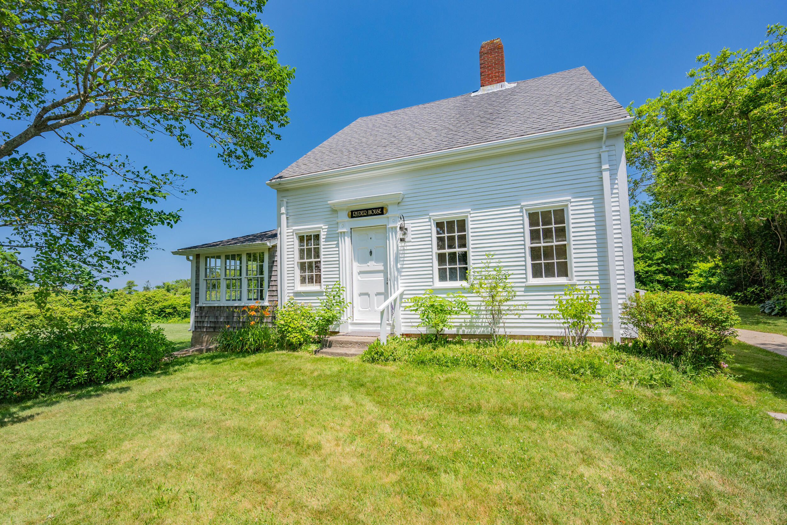 56 Wharf Lane Yarmouth Port, MA 02675 - Photo 49 of 71 a view of a house with a yard and plants