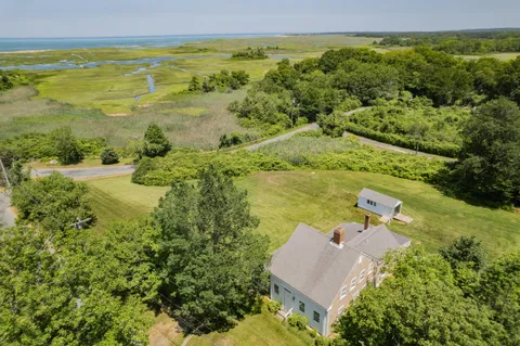 a view of a lake with a yard