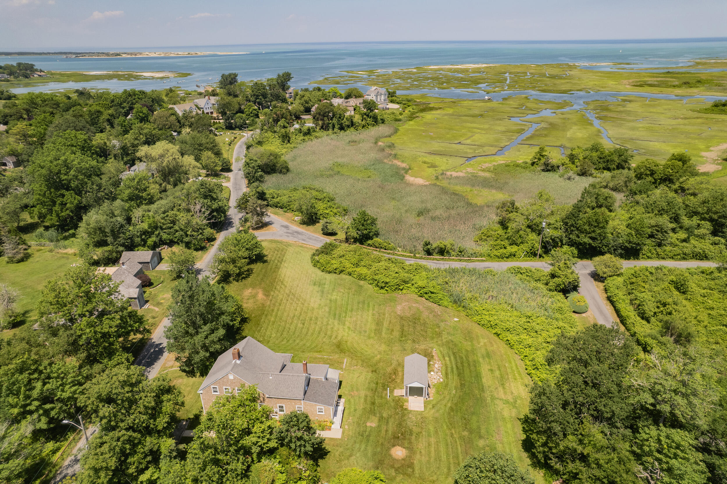 56 Wharf Lane Yarmouth Port, MA 02675 - Photo 6 of 71 a view of an ocean and a mountain