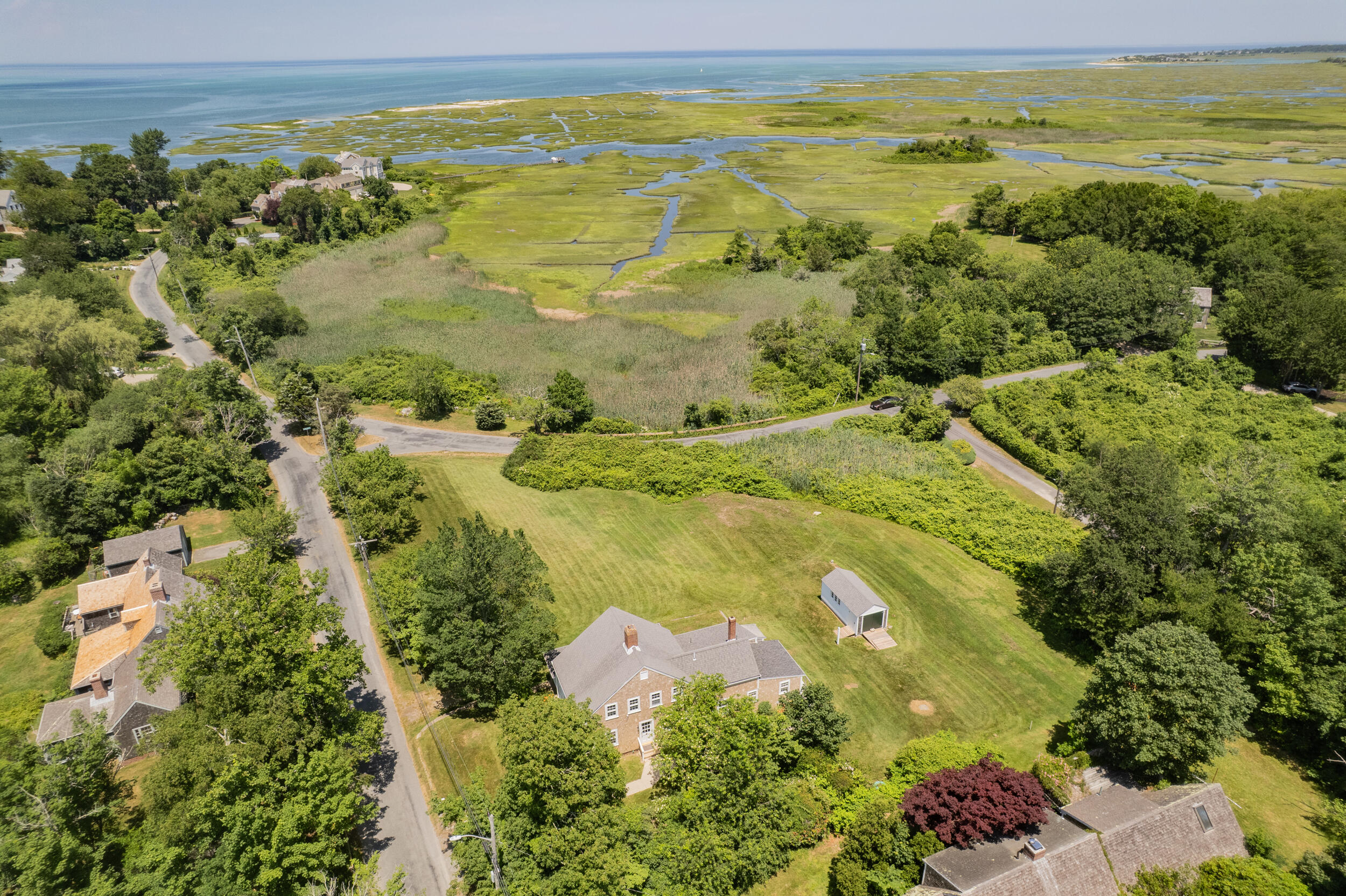 56 Wharf Lane Yarmouth Port, MA 02675 - Photo 7 of 71 a view of a lake with a yard