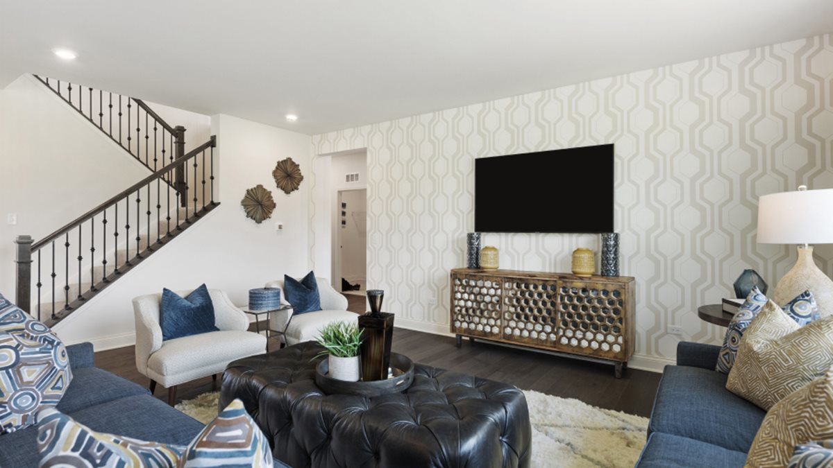16228 Longcommon Lane Plainfield, IL 60586 - Photo 7 of 21 a living room with furniture and a flat screen tv