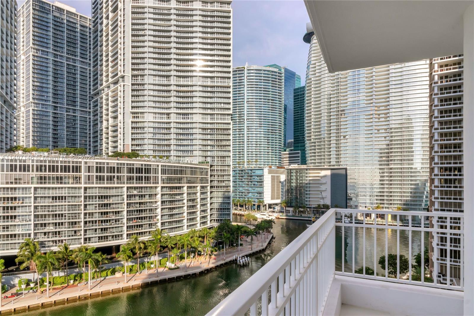 801 Brickell Key Boulevard, Unit 1102 Miami, FL 33131 - Photo 2 of 15 a view of balcony with a couple of cars parked in front of house