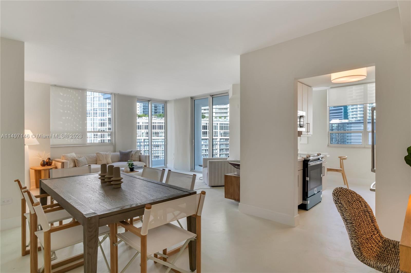 801 Brickell Key Boulevard, Unit 1102 Miami, FL 33131 - Photo 5 of 15 a view of a dining room with furniture and window