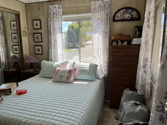 a bedroom with a bed and a window