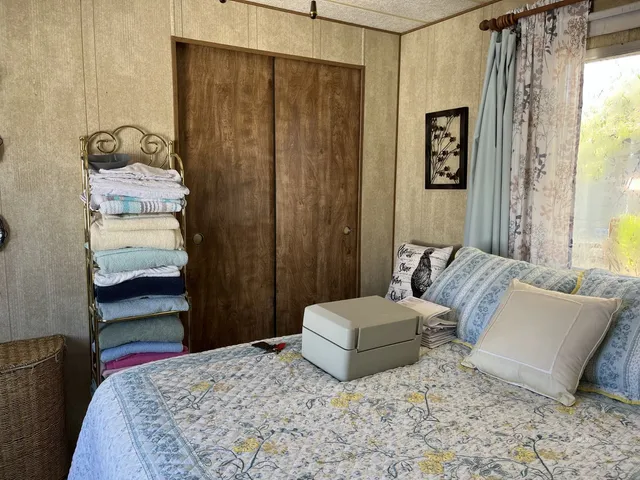 a bedroom with a bed and a couch