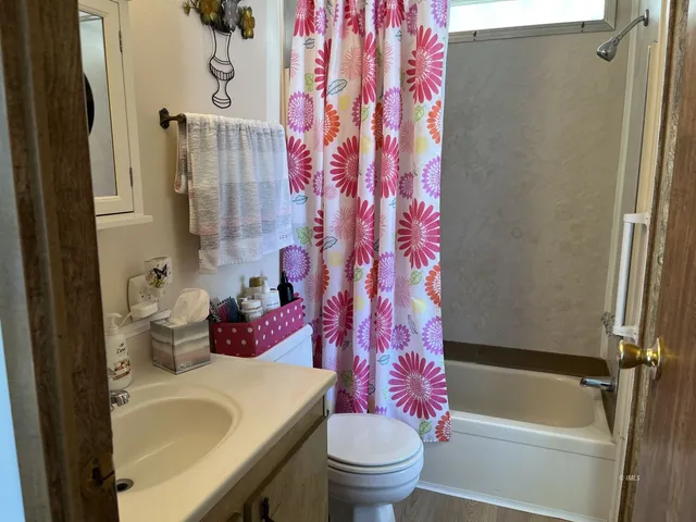 a bedroom with a bed and a mirror