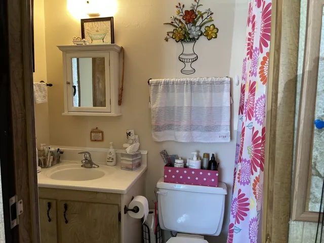 a view of a kitchen with a stove and cabinets
