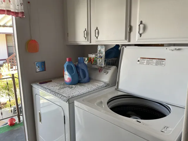 a view of a pathway with a flower garden