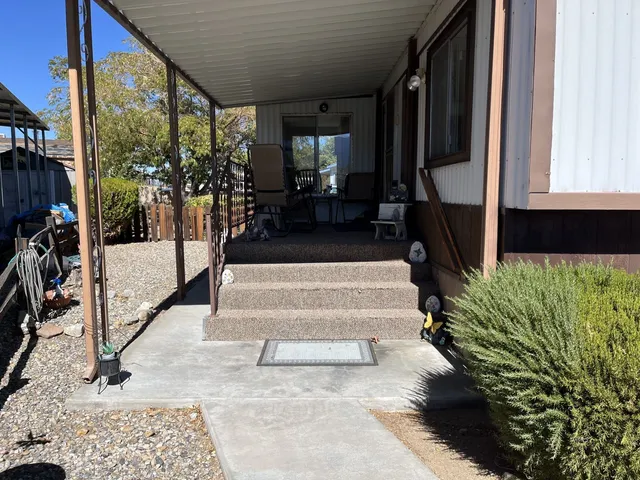 a view of living room filled with furniture and a potted plant