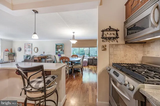 a view of a kitchen and dining area with furniture