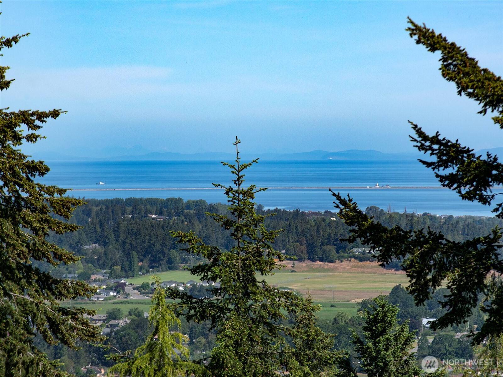 -nka Owls Nest Road Sequim, WA 98382 - Photo 23 of 38 a view of a lake with a city