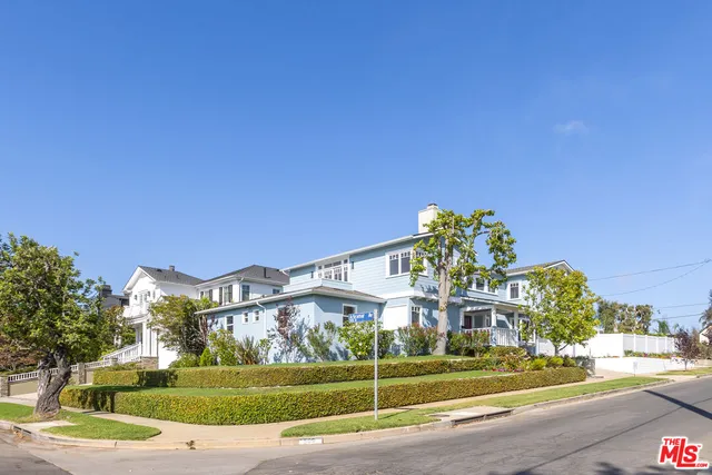a view of a building with a yard