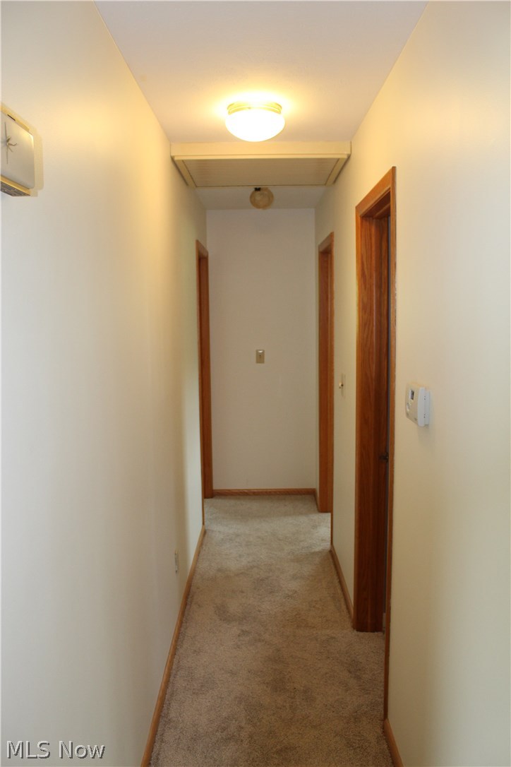 2380 Lee Creek Road Belleville, WV 26133 - Photo 12 of 23 Hallway -looking toward bedrooms. Notice whole house attic fan.